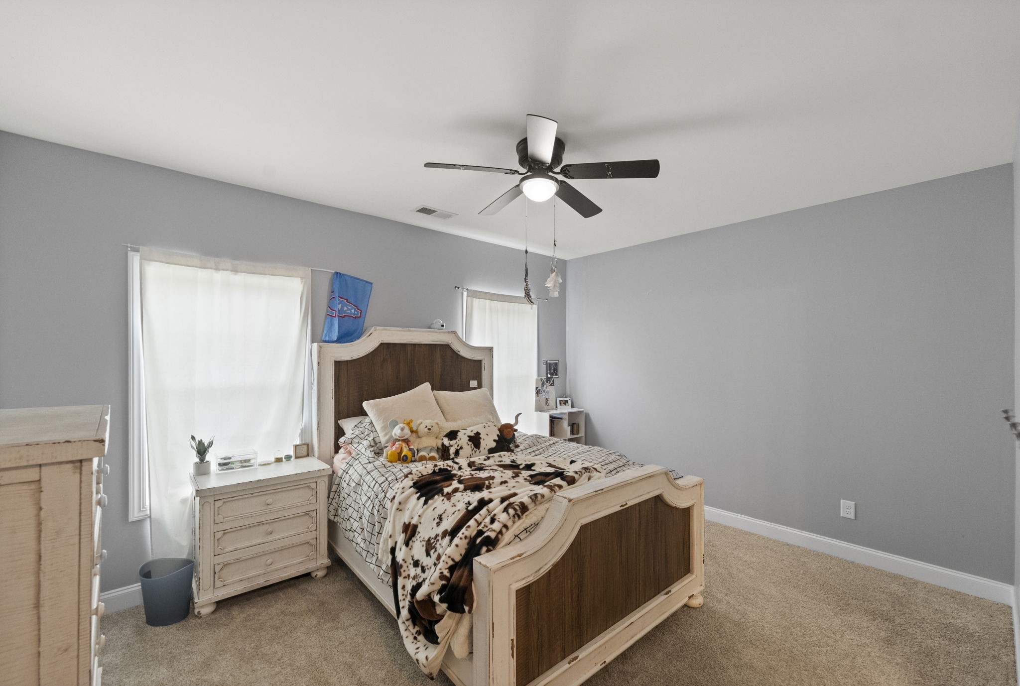 147 Roberts Road Portland, TN 37148 - Photo 21 of 30 a bed room with a bed and a ceiling fan