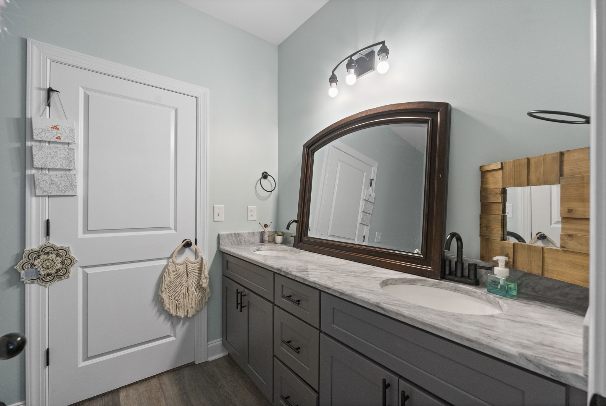147 Roberts Road Portland, TN 37148 - Photo 22 of 30 a bathroom with a granite countertop sink and a mirror