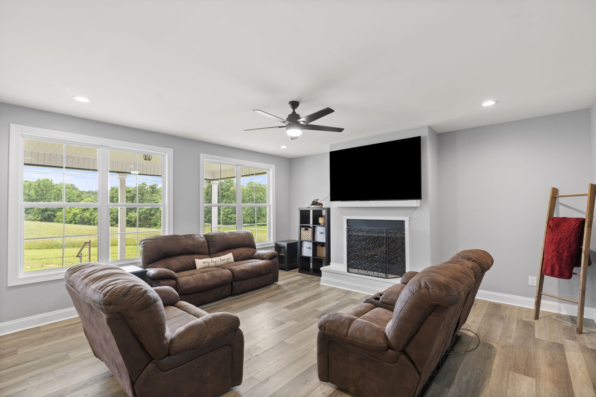 147 Roberts Road Portland, TN 37148 - Photo 6 of 30 a living room with furniture a fireplace and a flat screen tv