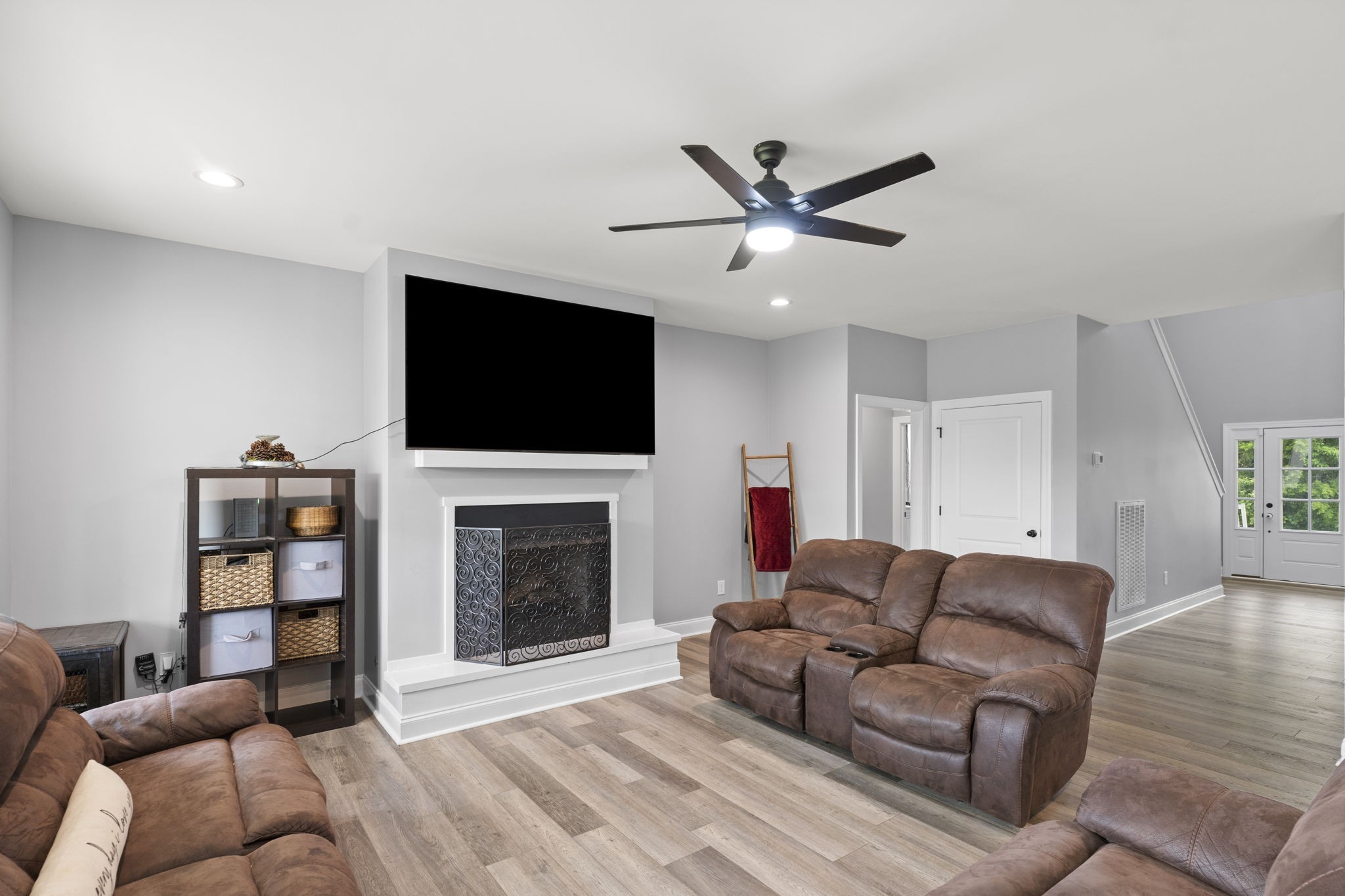 147 Roberts Road Portland, TN 37148 - Photo 7 of 30 a living room with furniture a fireplace and a flat screen tv