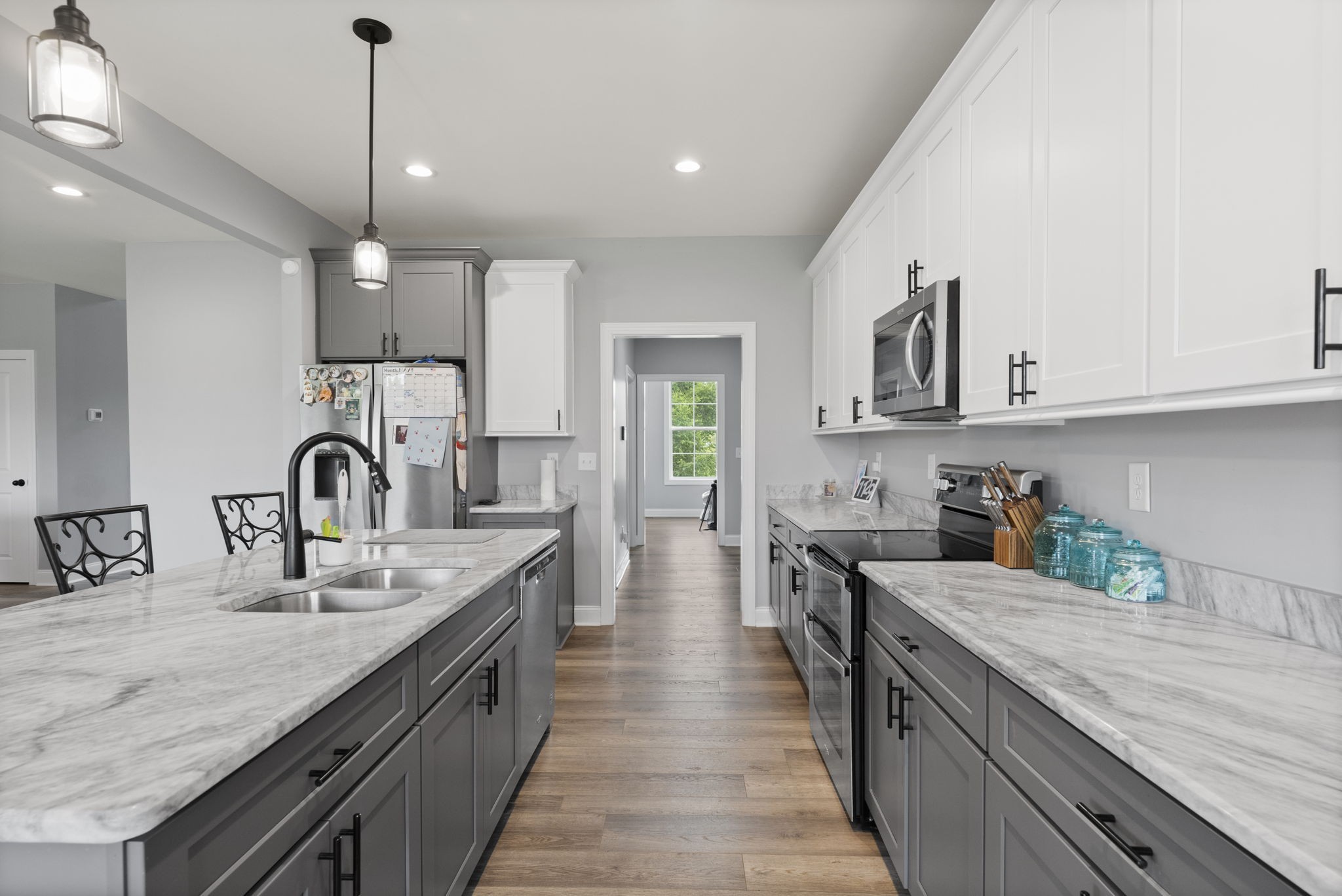 147 Roberts Road Portland, TN 37148 - Photo 10 of 30 a kitchen with granite countertop a sink and cabinets