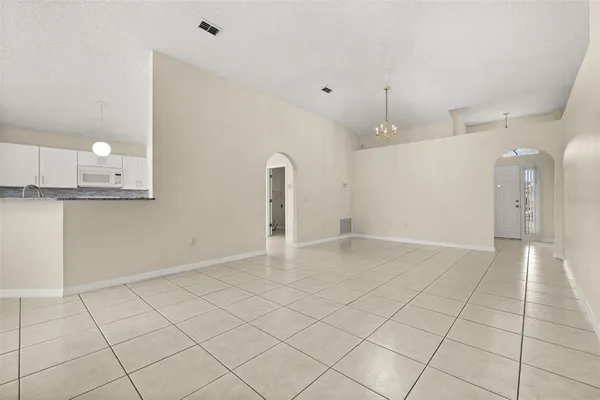 a view of a kitchen with a sink and cabinets