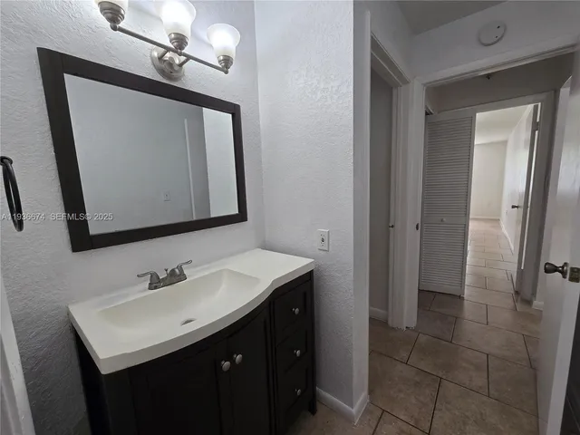 a bathroom with a toilet and a bathtub