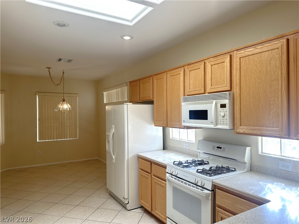 3034 Canal Walk Road Henderson, NV 89052 - Photo 22 of 24 This spacious kitchen offers a skylight and ample cabinet space for all your culinary needs.