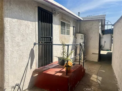 a bed sitting in a room next to a window