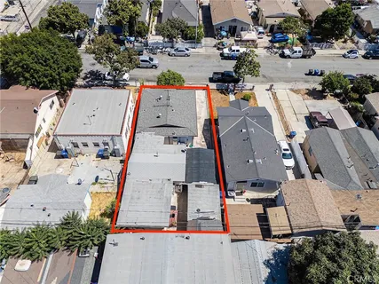 an aerial view of residential houses with outdoor space