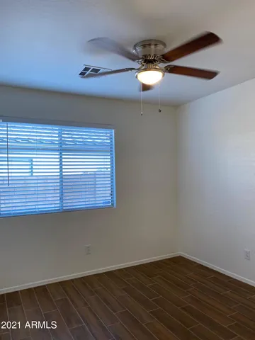 en empty room with wooden floor