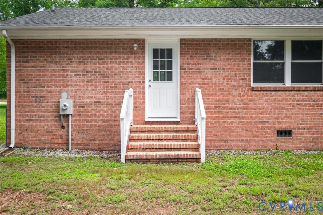 4400 Treely Road Chester, VA 23831 - Photo 46 of 47 Brick exterior featuring a white paneled door with