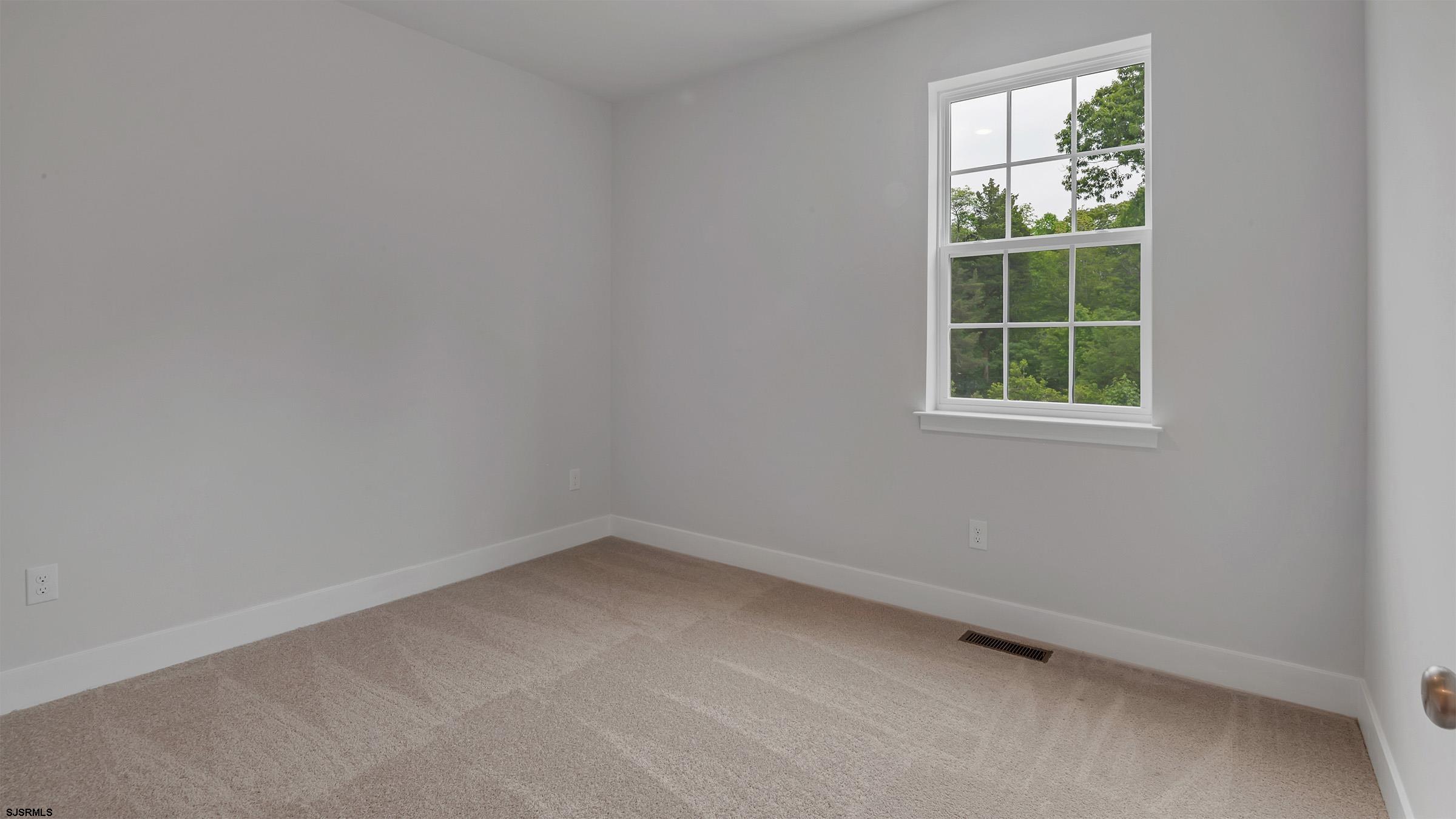 12 Henry Road Marmora, NJ 08223 - Photo 12 of 16 an empty room with a window