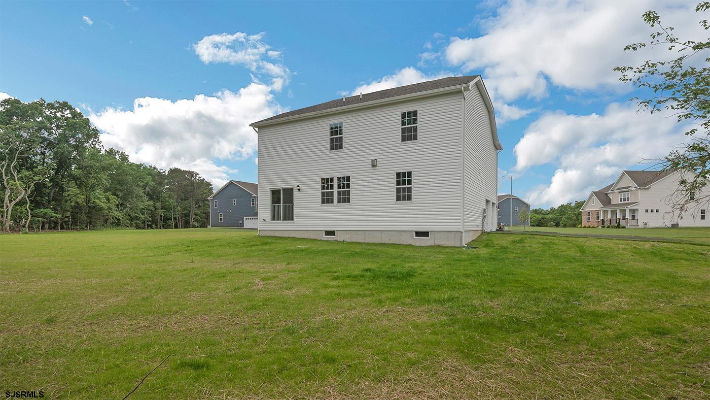 12 Henry Road Marmora, NJ 08223 - Photo 16 of 16 a view of a house with a backyard