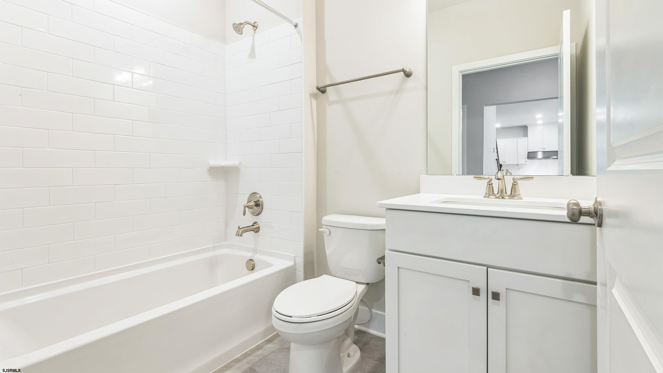 12 Henry Road Marmora, NJ 08223 - Photo 9 of 16 a bathroom with a sink toilet and shower
