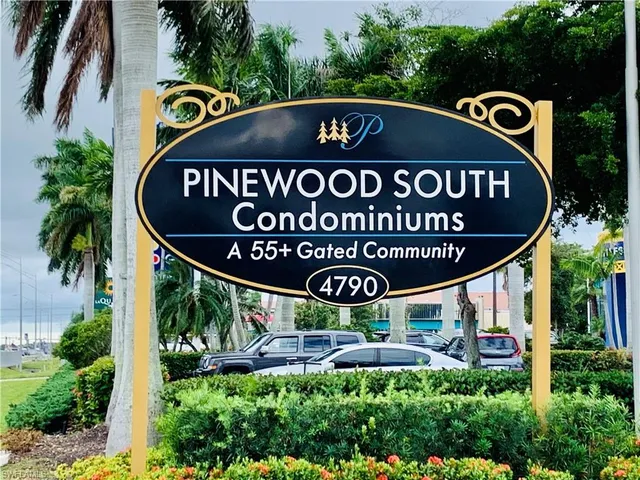 a front of a sign board with a yard