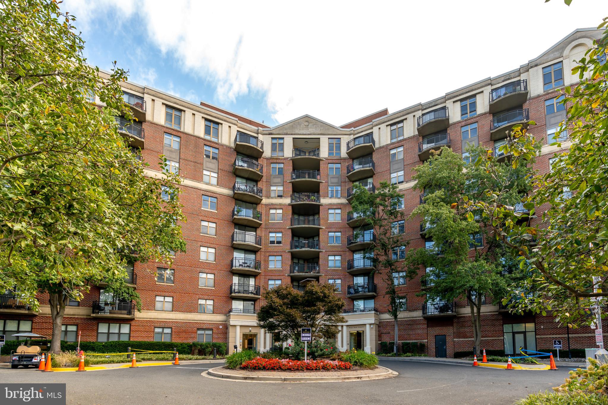 Charming brick residence with lush surroundings.
