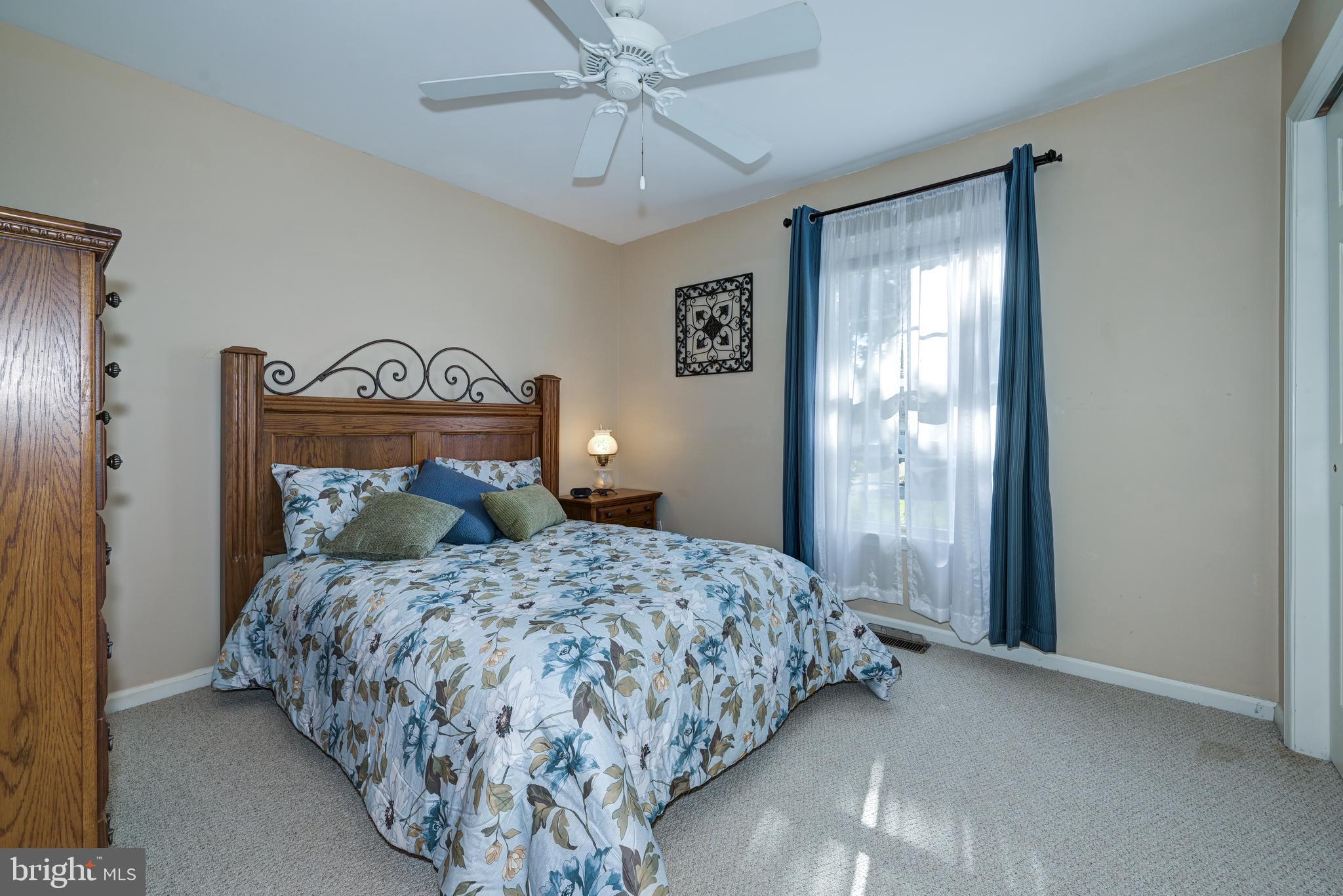 137 Skipper Road Manahawkin, NJ 08050 - Photo 25 of 33 a bedroom with a bed and a window