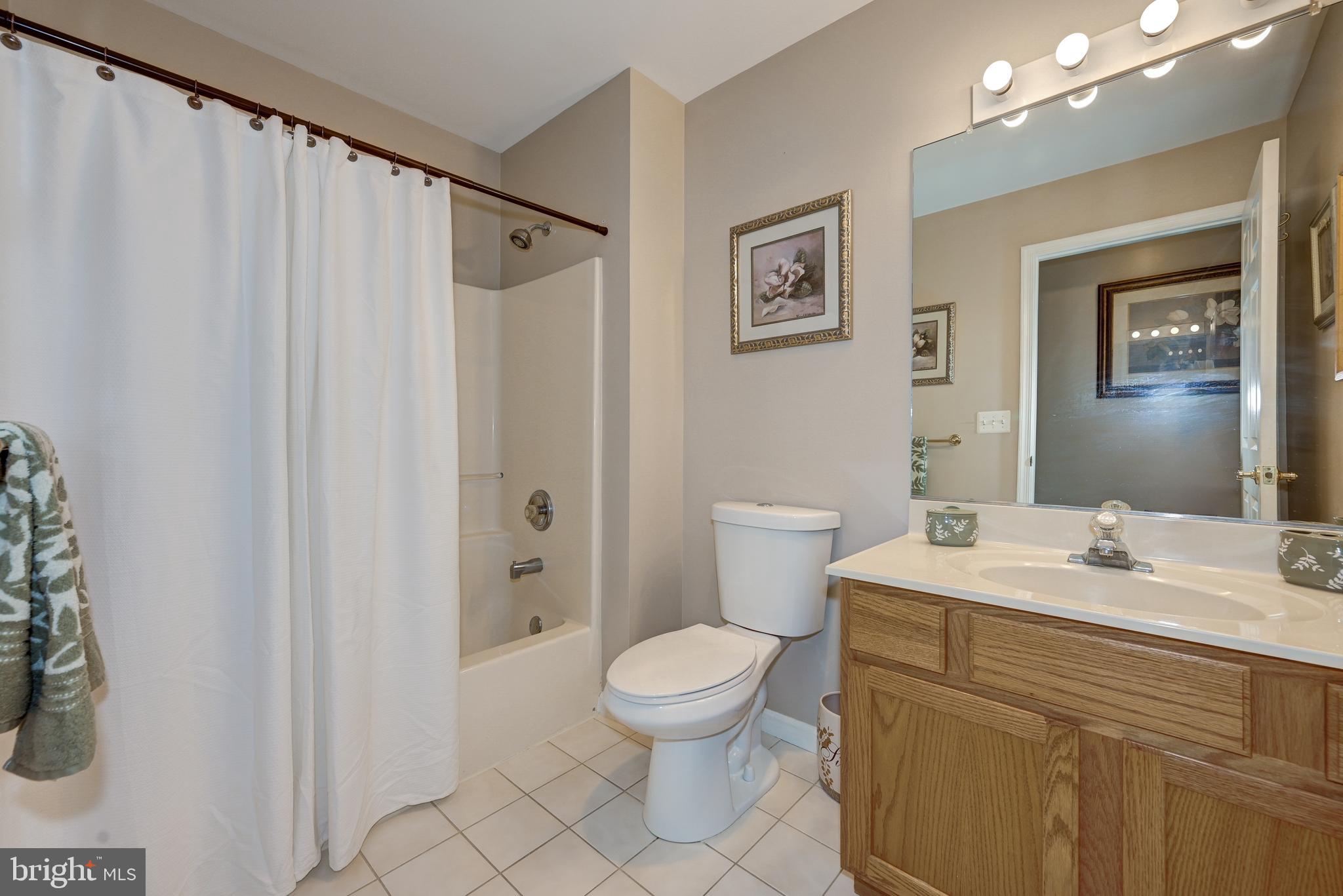 137 Skipper Road Manahawkin, NJ 08050 - Photo 26 of 33 a bathroom with a sink a toilet and shower