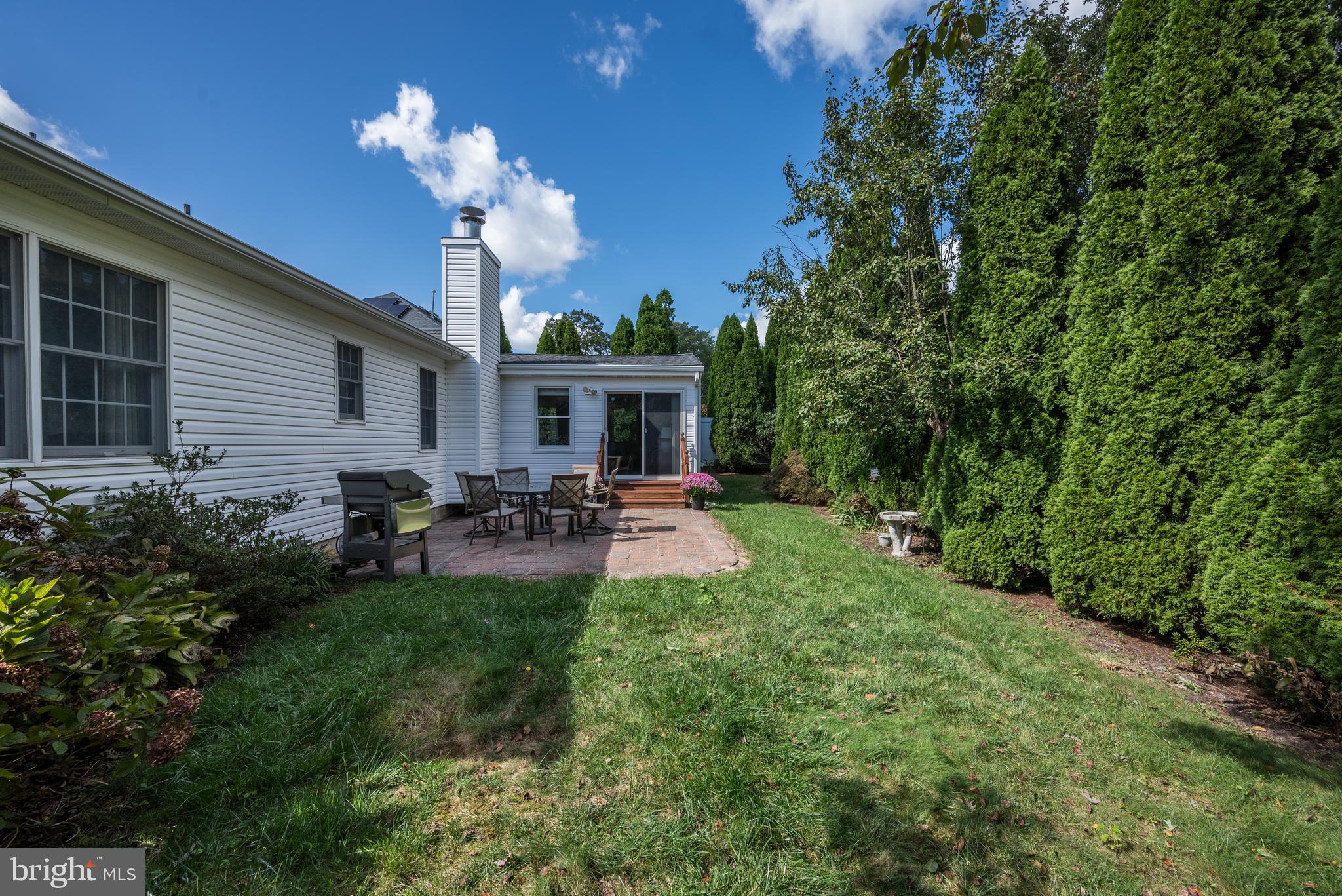 137 Skipper Road Manahawkin, NJ 08050 - Photo 28 of 33 a view of a house with backyard and sitting area