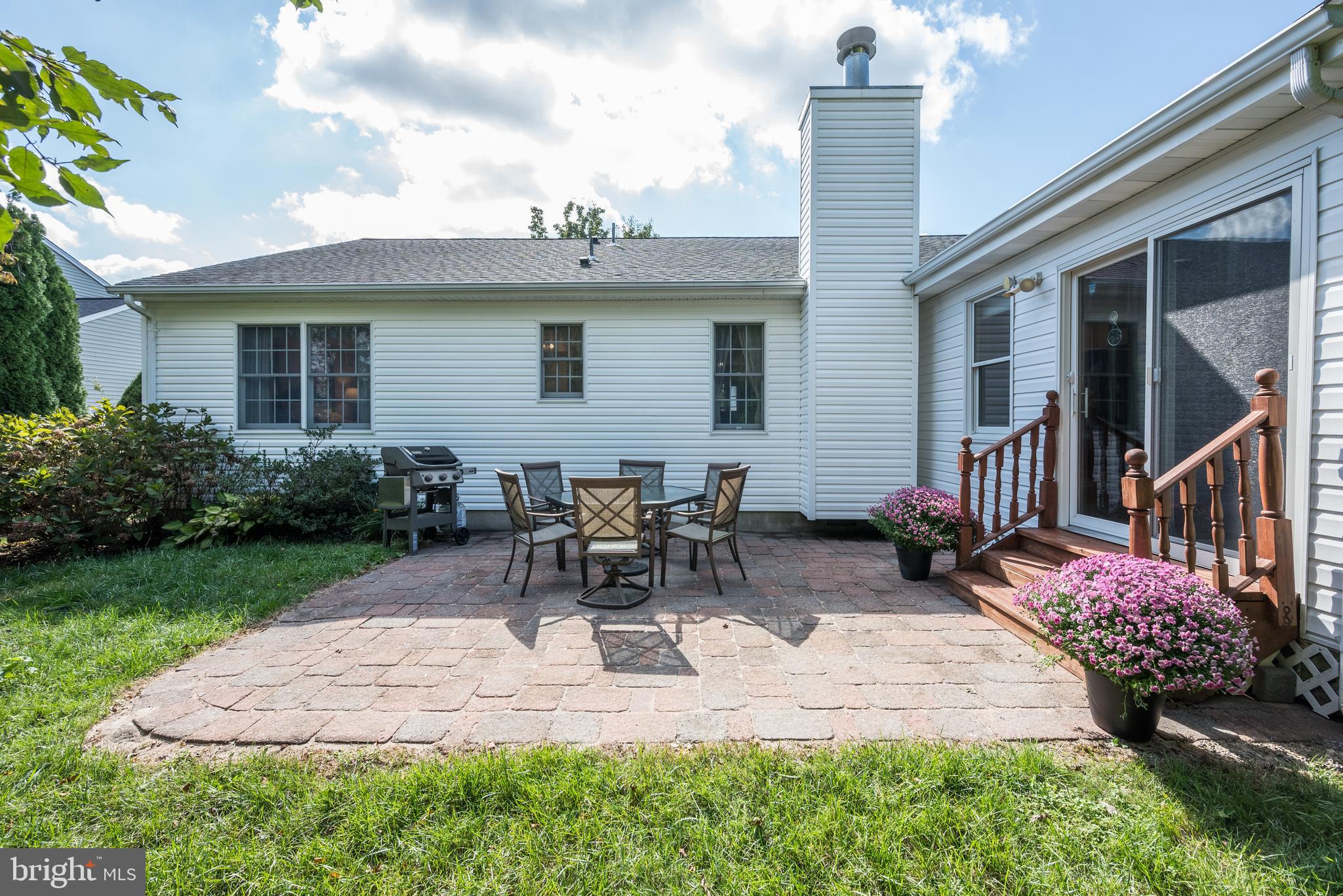 137 Skipper Road Manahawkin, NJ 08050 - Photo 29 of 33 a view of backyard with outdoor seating and plants