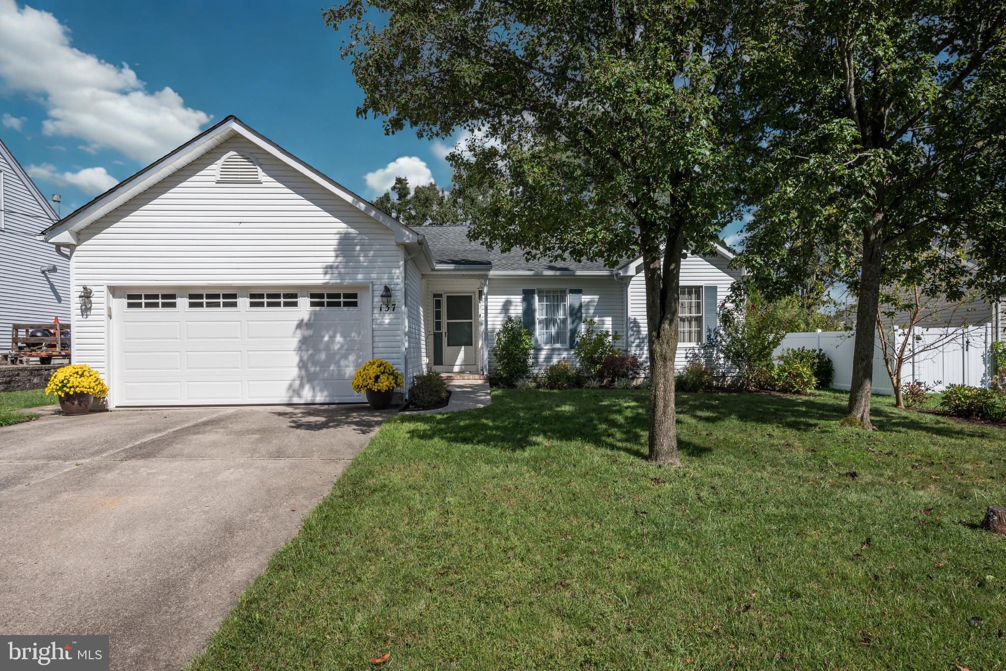 137 Skipper Road Manahawkin, NJ 08050 - Photo 3 of 33 a view of a house with backyard and sitting area