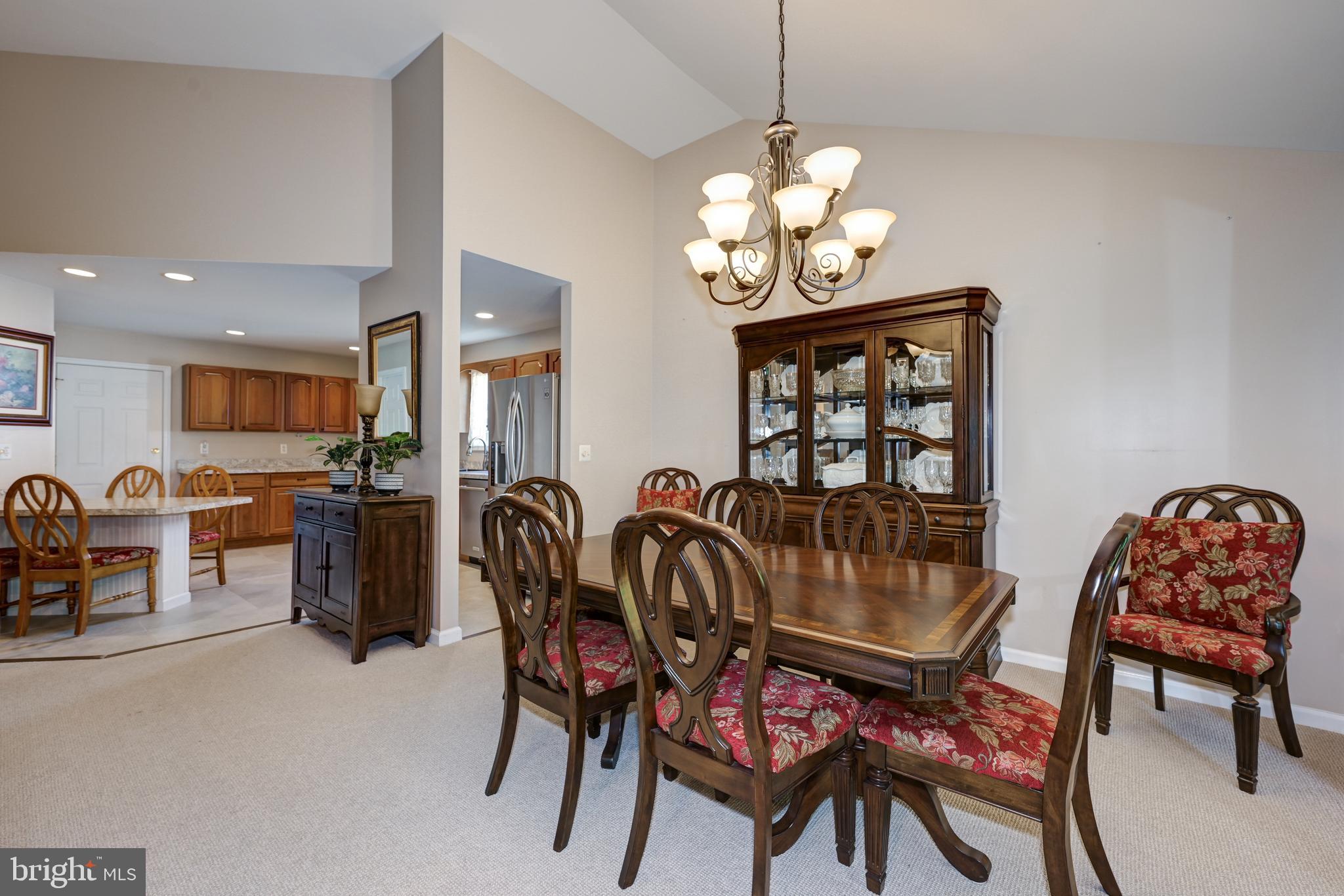 137 Skipper Road Manahawkin, NJ 08050 - Photo 9 of 33 a view of a dining room with furniture and chandelier