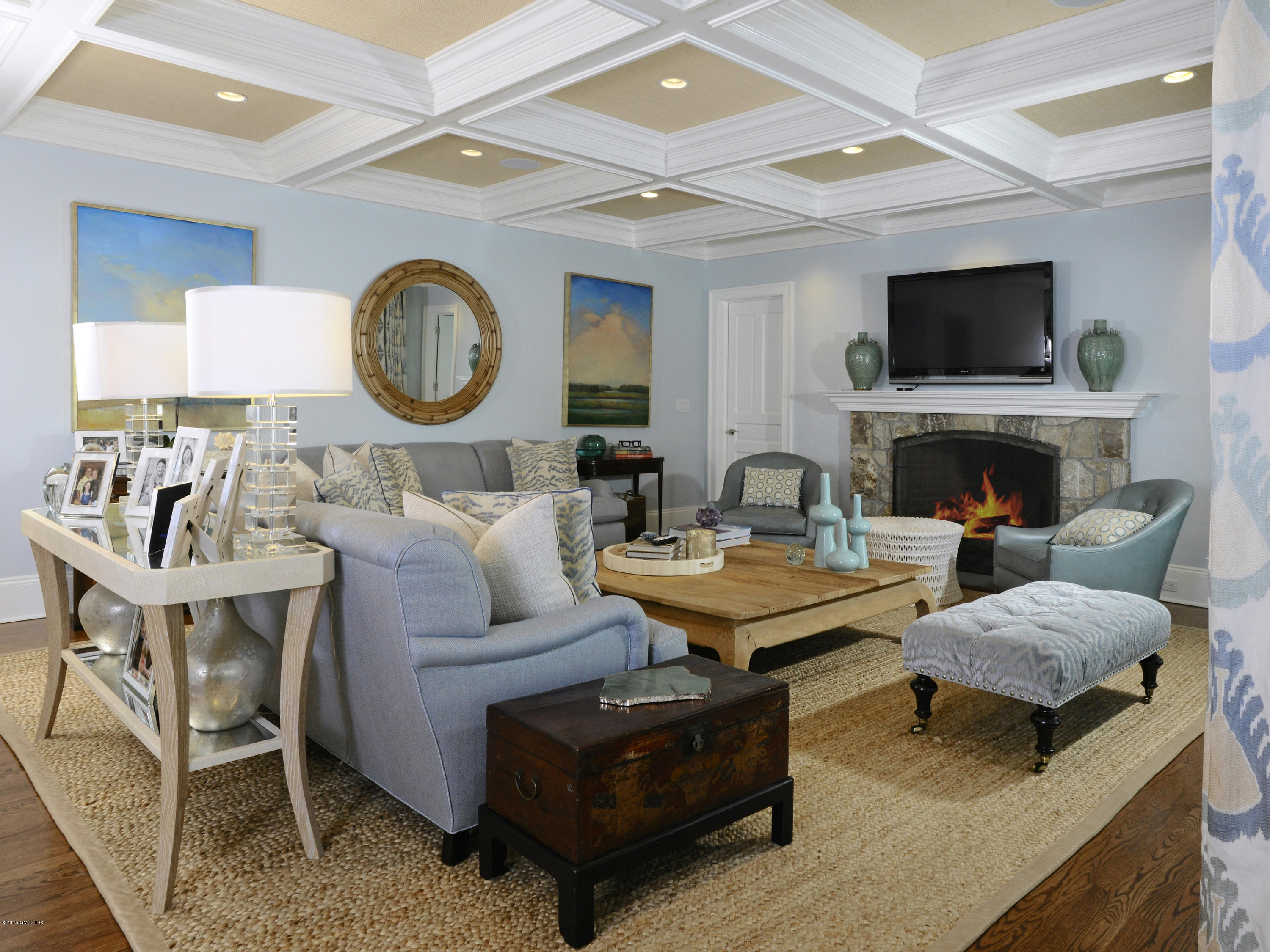 58 Brookridge Drive Greenwich, CT 06830 - Photo 11 of 18 a living room with furniture a flat screen tv and a fireplace