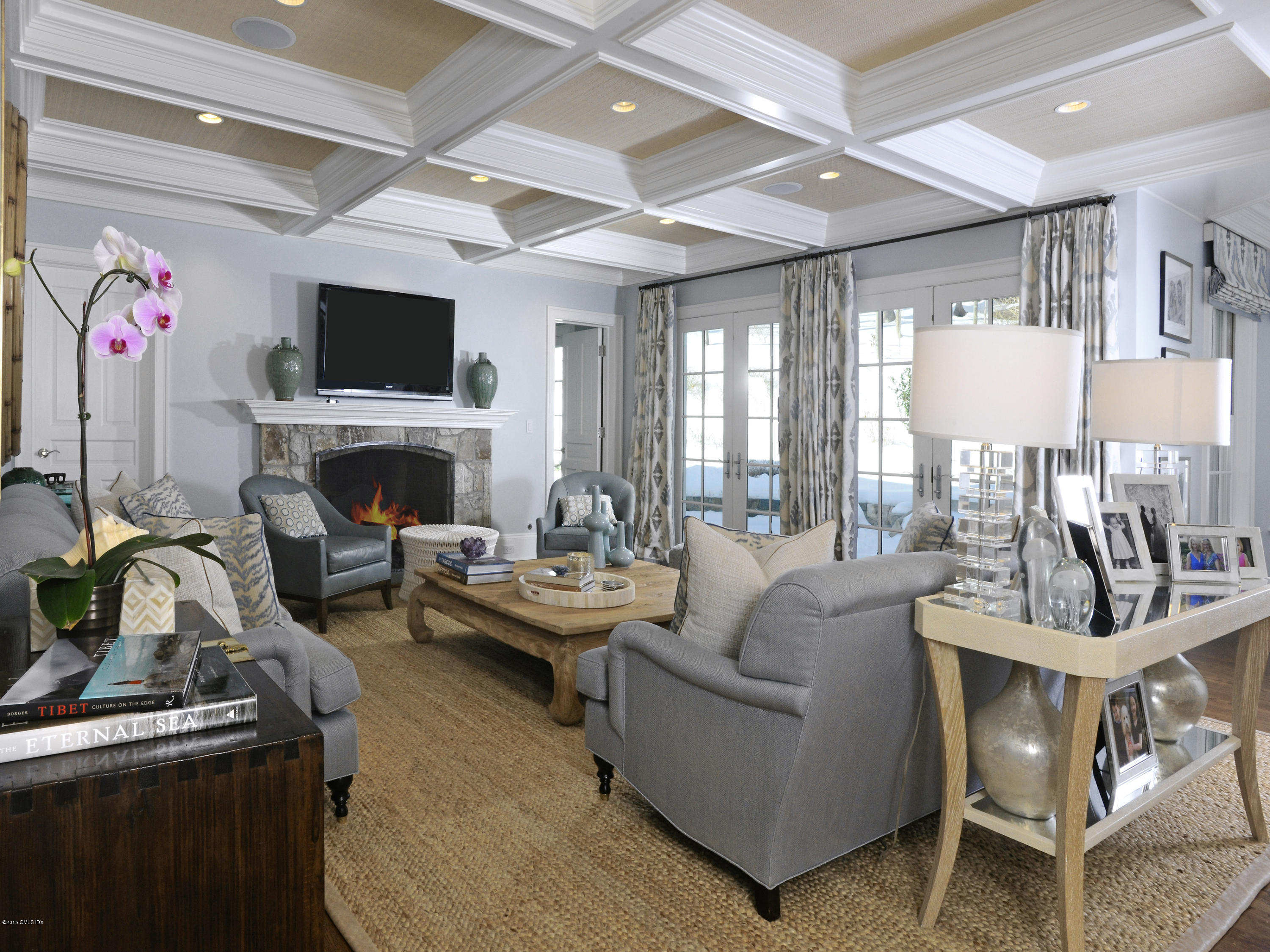 58 Brookridge Drive Greenwich, CT 06830 - Photo 10 of 18 a living room with furniture a flat screen tv and a fireplace