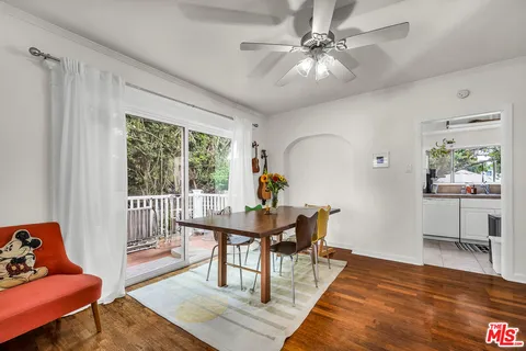 a workspace with furniture window and wooden floor