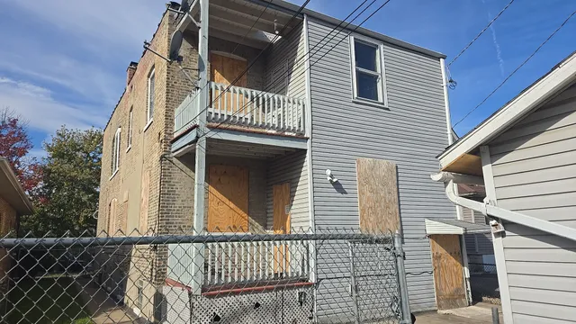 a view of a house with wooden stairs