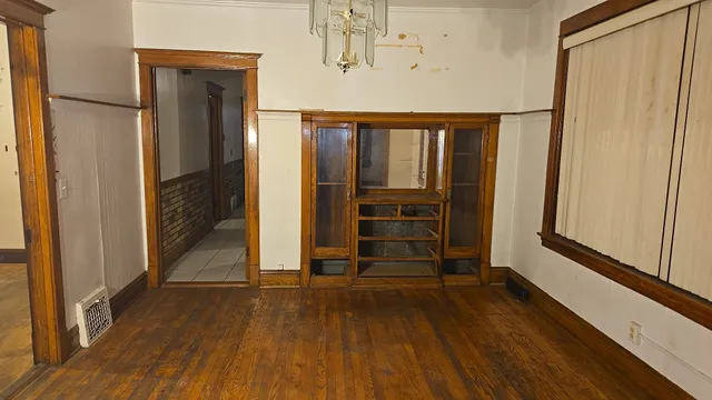 a view of front door with wooden floor