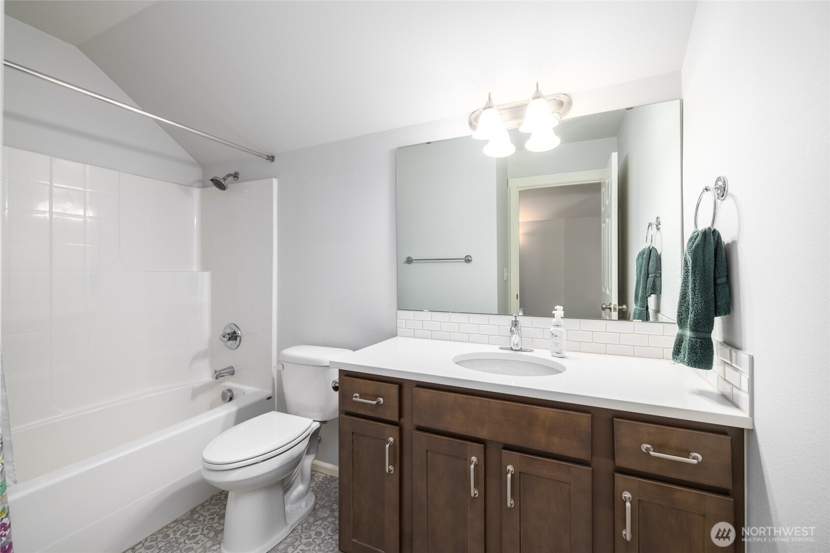 232 Sinclair Alley Mount Vernon, WA 98274 - Photo 20 of 33 a bathroom with a sink a toilet a large mirror and shower