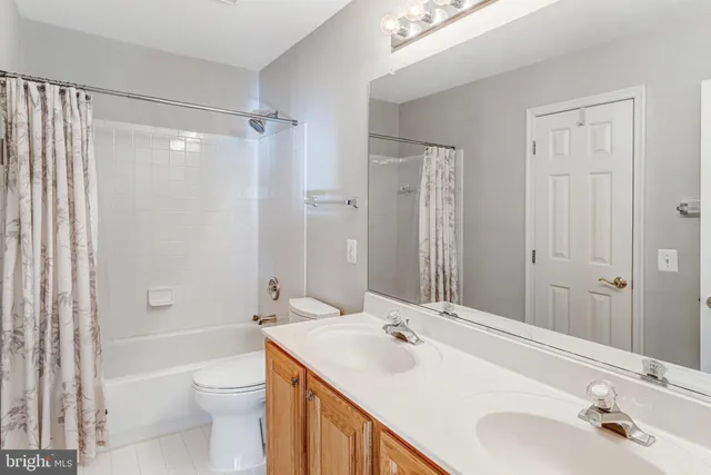 a bathroom with a sink toilet tub and shower