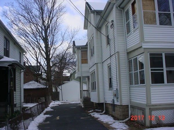 98-100 Draper Street Springfield, MA 01108 - Photo 3 of 4 a view of a brick house with many windows