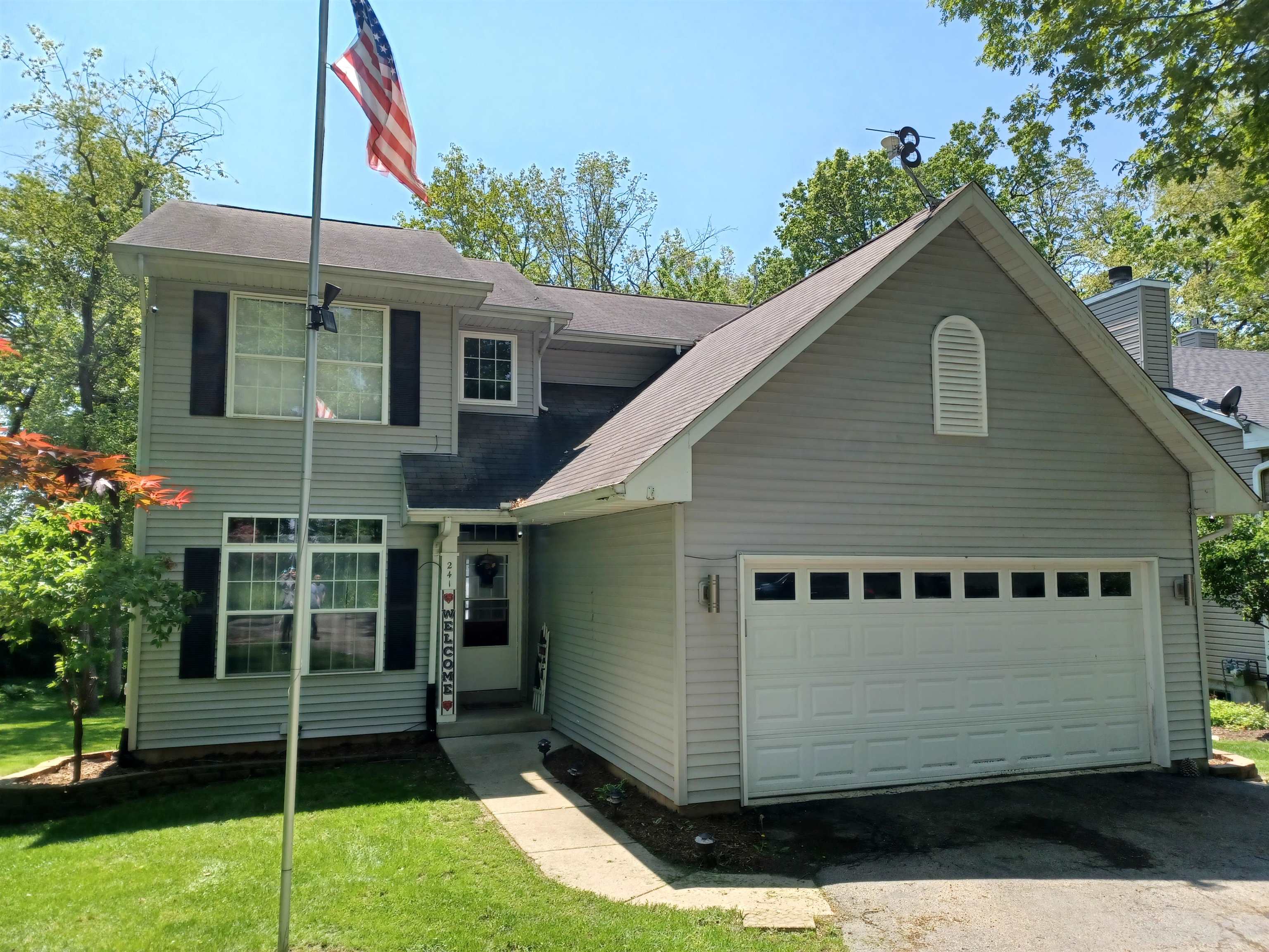 241 Rochester Road Northeast Poplar Grove, IL 61065 - Photo 1 of 32 a view of a house with a yard