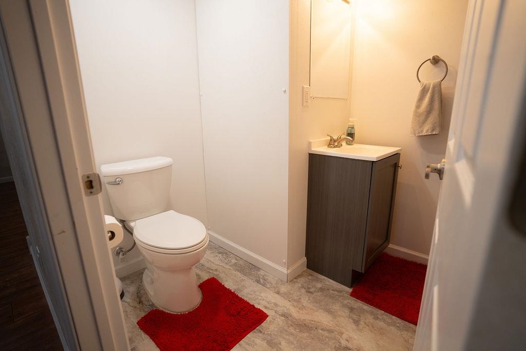 241 Rochester Road Northeast Poplar Grove, IL 61065 - Photo 17 of 32 a bathroom with a sink and a mirror