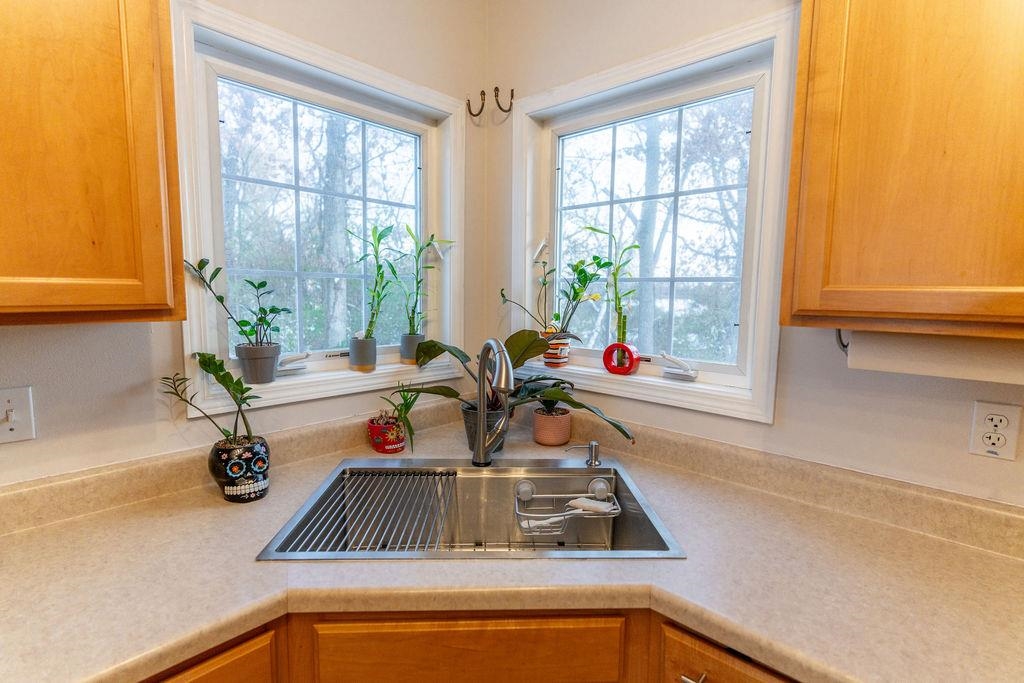 241 Rochester Road Northeast Poplar Grove, IL 61065 - Photo 9 of 32 a kitchen with a sink and a window
