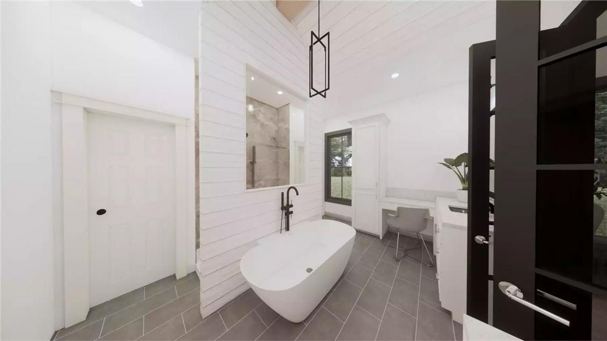 204 Rogers Road Pendleton, SC 29670 - Photo 9 of 12 This serene bathroom offers a spacious soaking tub and shower, with modern fixtures and natural light.