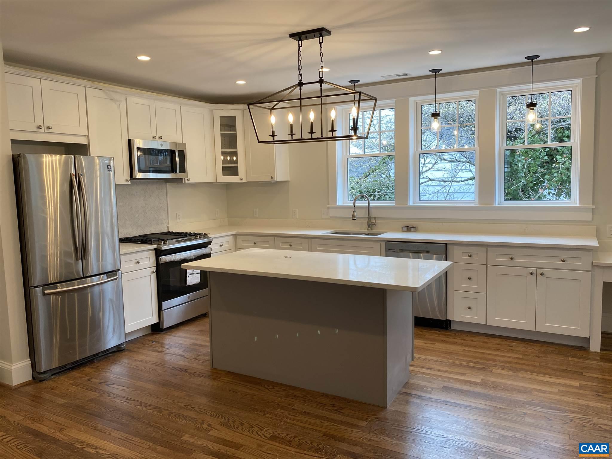 1928 Lewis Mountain Road, Unit B Charlottesville, VA 22903 - Photo 20 of 22 a kitchen with stainless steel appliances granite countertop a refrigerator a sink dishwasher a stove and a refrigerator