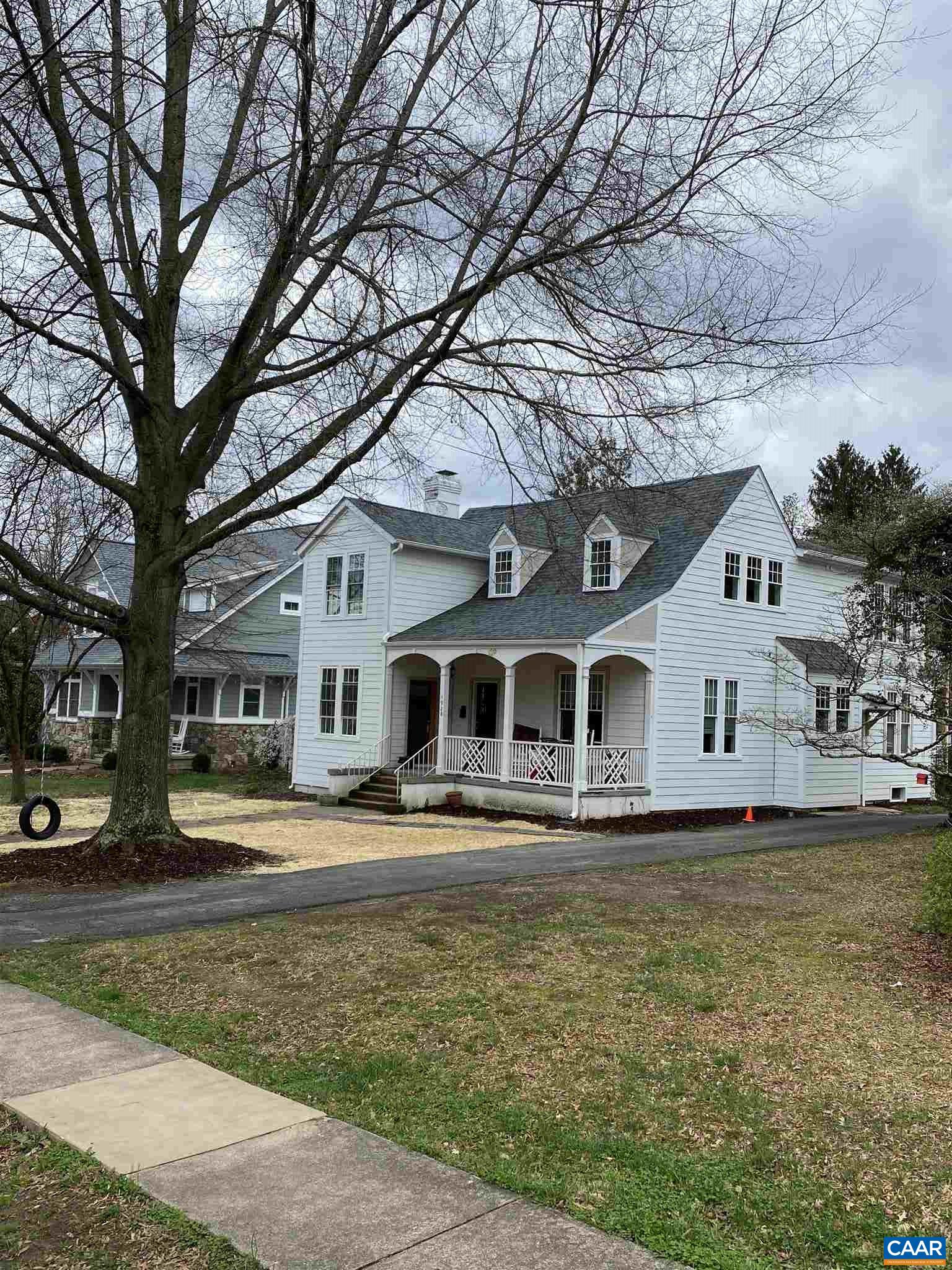 1928 Lewis Mountain Road, Unit B Charlottesville, VA 22903 - Photo 2 of 22 a front view of a house with a yard