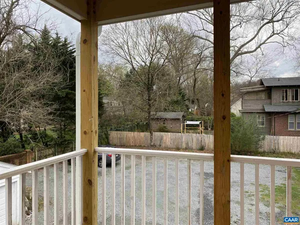 a view of balcony with small trees