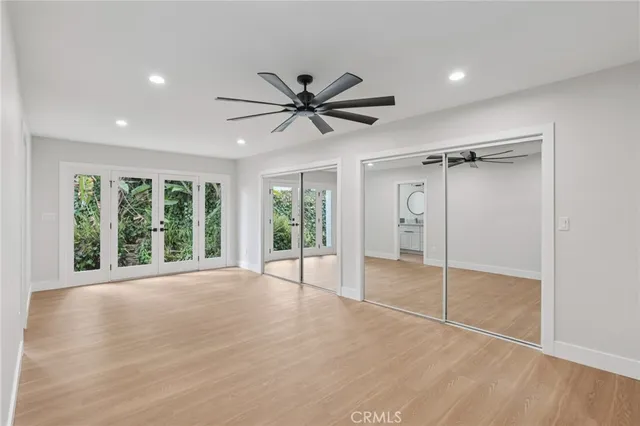 a view of a livingroom with a ceiling fan and window