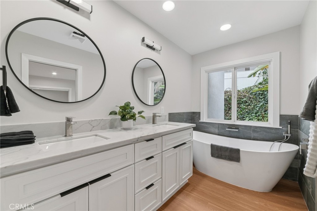 20 Saddle Road Rancho Palos Verdes, CA 90275 - Photo 20 of 44 a bathroom with a double vanity sink and a large mirror