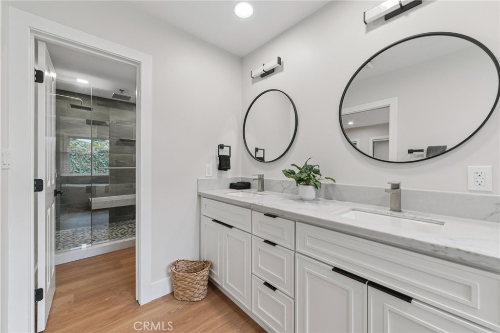 20 Saddle Road Rancho Palos Verdes, CA 90275 - Photo 22 of 44 a bathroom with a double vanity sink and a mirror