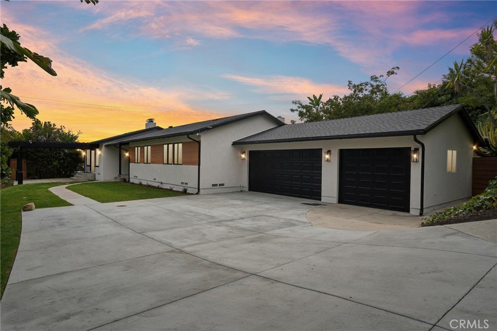 20 Saddle Road Rancho Palos Verdes, CA 90275 - Photo 2 of 44 a front view of a house with a yard and garage