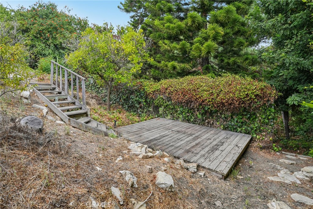 20 Saddle Road Rancho Palos Verdes, CA 90275 - Photo 38 of 44 a view of a wooden deck with trees in the background