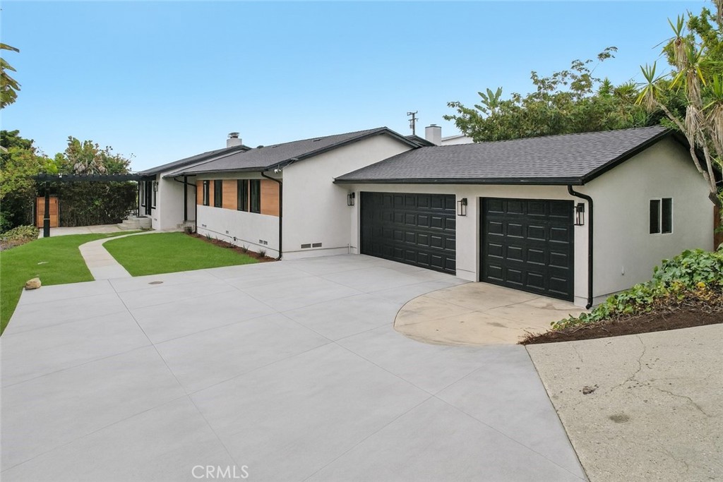 20 Saddle Road Rancho Palos Verdes, CA 90275 - Photo 3 of 44 a view of a house with a yard and garage