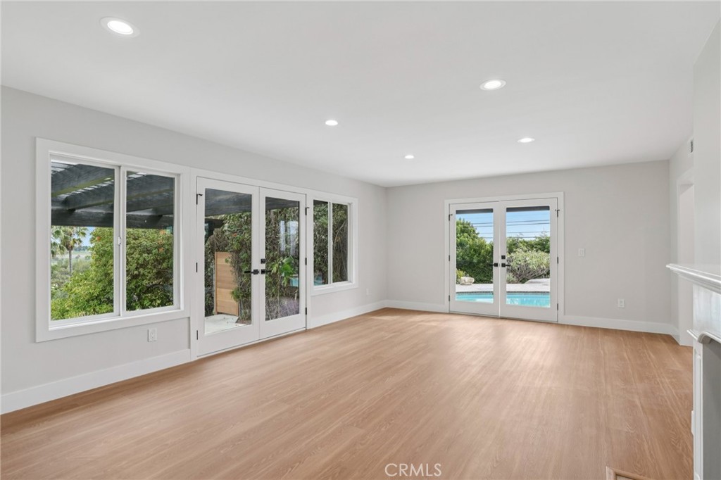 20 Saddle Road Rancho Palos Verdes, CA 90275 - Photo 6 of 44 a view of an empty room with wooden floor and windows