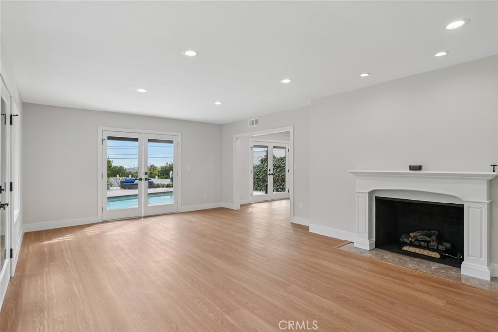 20 Saddle Road Rancho Palos Verdes, CA 90275 - Photo 7 of 44 a view of an empty room with wooden floor and a fireplace