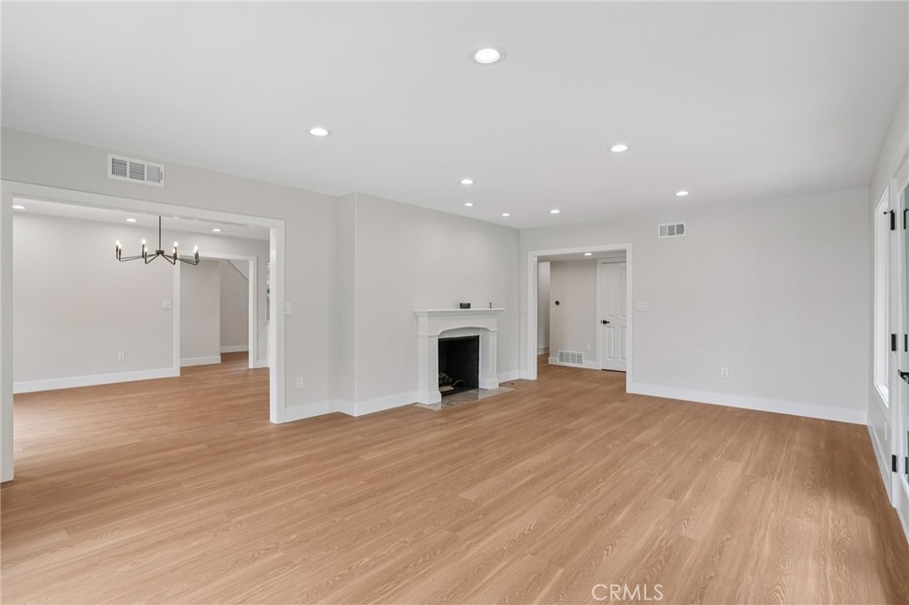 20 Saddle Road Rancho Palos Verdes, CA 90275 - Photo 8 of 44 a view of a big room with wooden floor and a fireplace