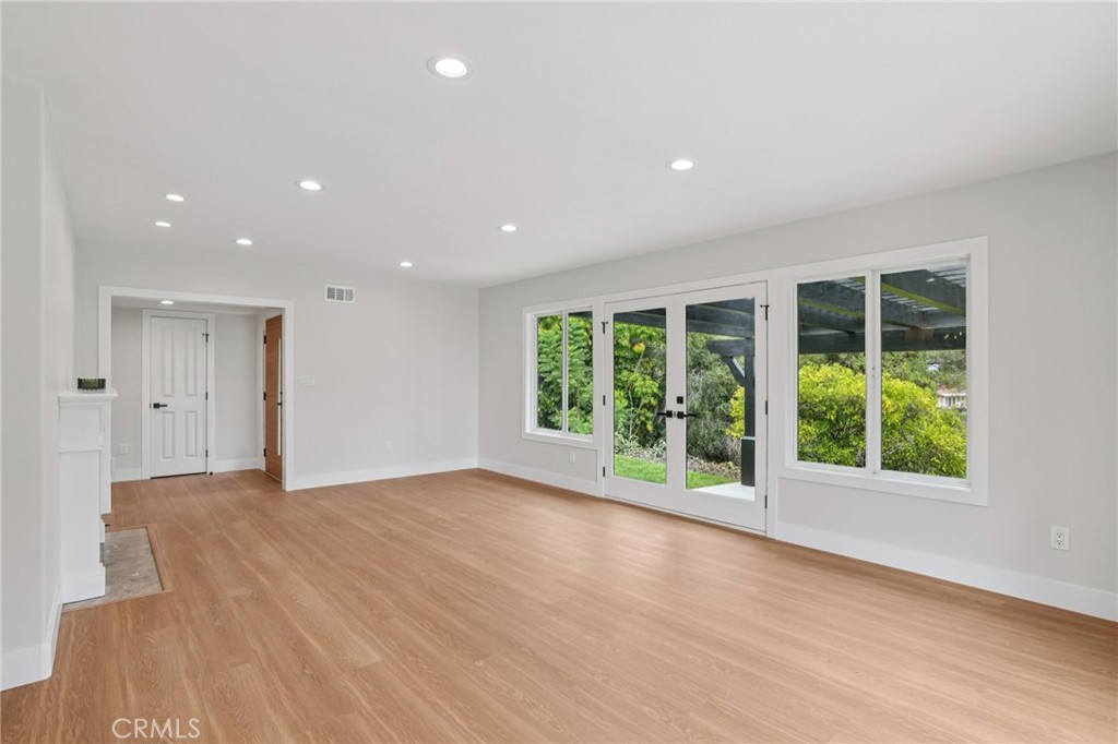 20 Saddle Road Rancho Palos Verdes, CA 90275 - Photo 9 of 44 a view of an empty room with wooden floor and windows