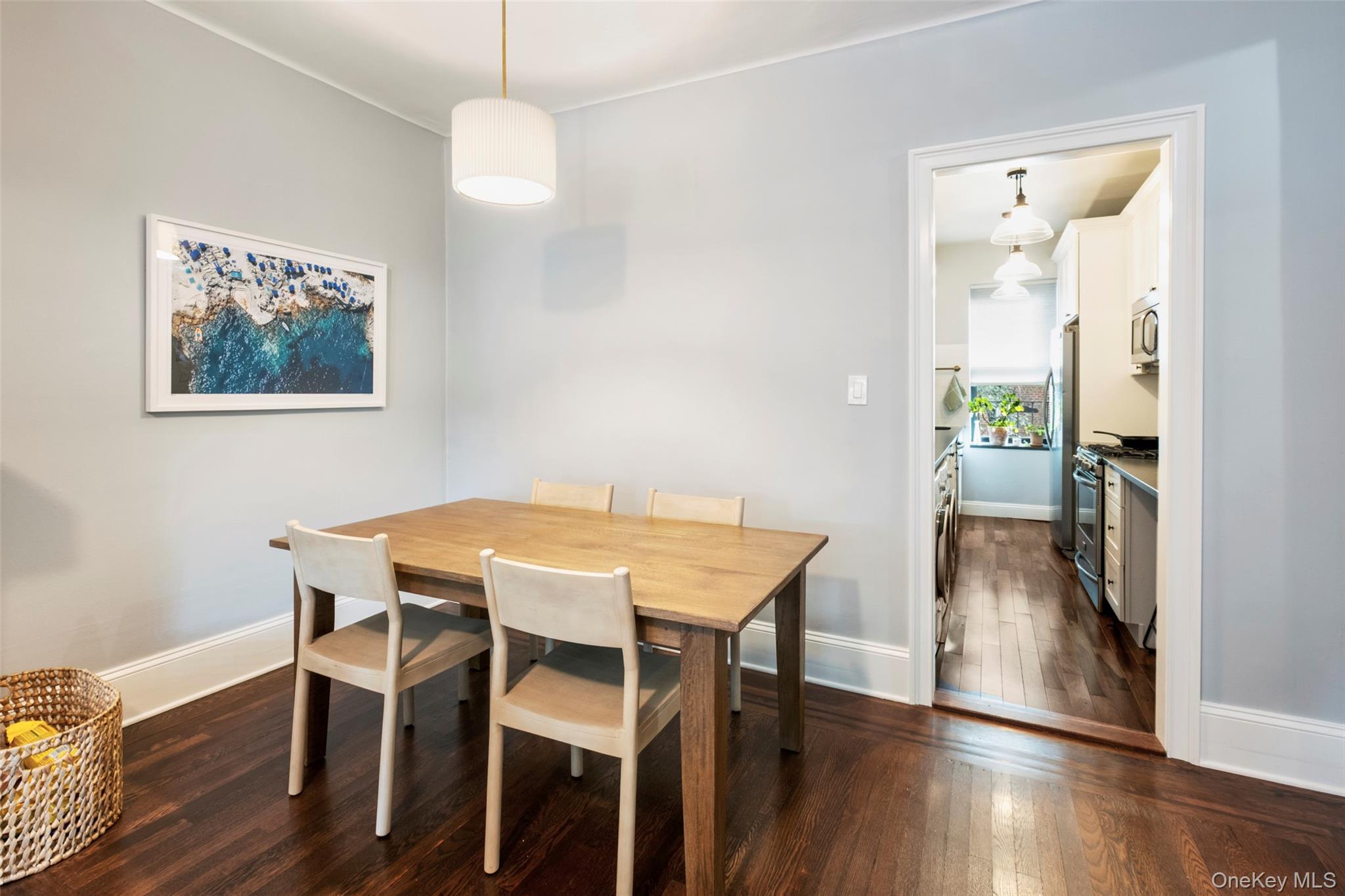 244 Bronxville Road, Unit G3 Bronxville, NY 10708 - Photo 3 of 18 a view of a dining room with furniture wooden floor and a chandelier