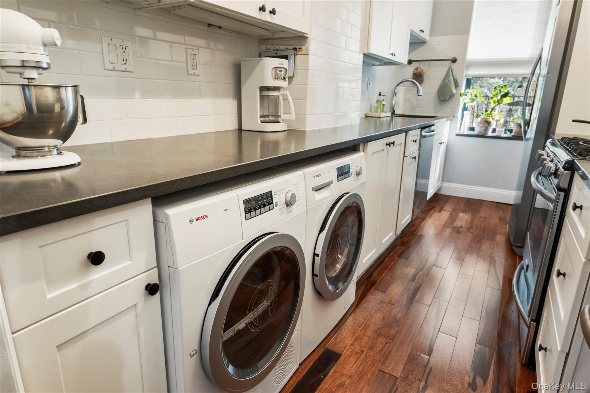 244 Bronxville Road, Unit G3 Bronxville, NY 10708 - Photo 5 of 18 a utility room with cabinets and a wooden floors
